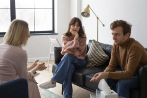 medium-shot-couple-undergoing-therapy