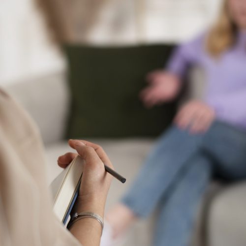 sided-view-young-girl-talking-therapist